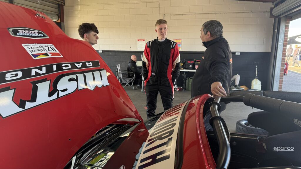 Luke in garage talking with Steve